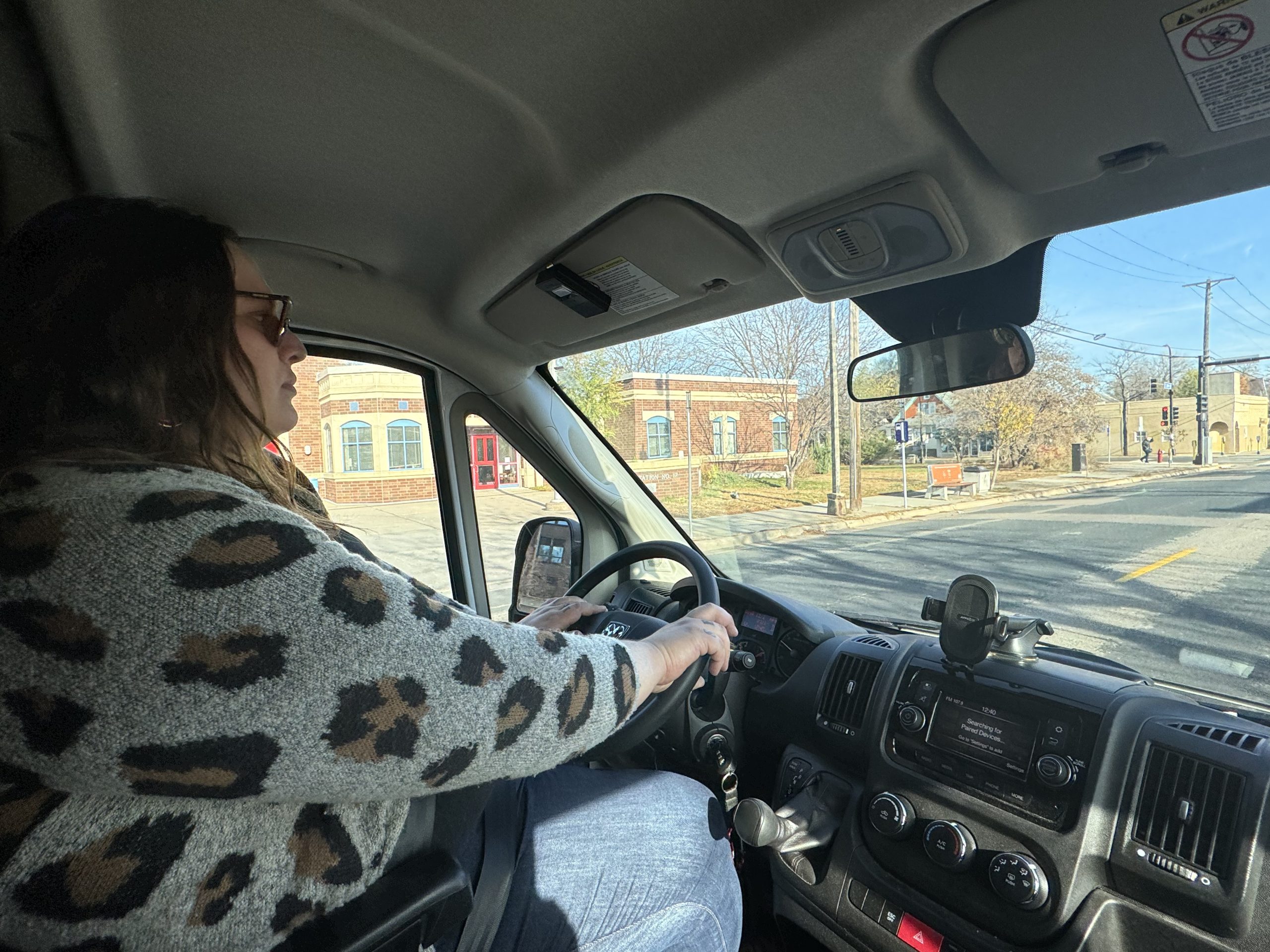 Amber Muhm driving the Aliveness Project van through Minneapolis.