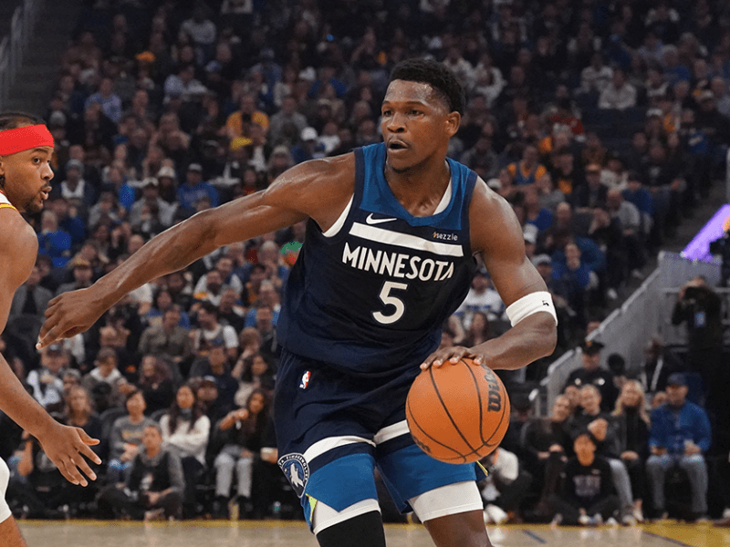 Timberwolves guard Anthony Edwards driving to the basket against Golden State Warriors guard Moses Moody in the first period at Chase Center on Sunday.