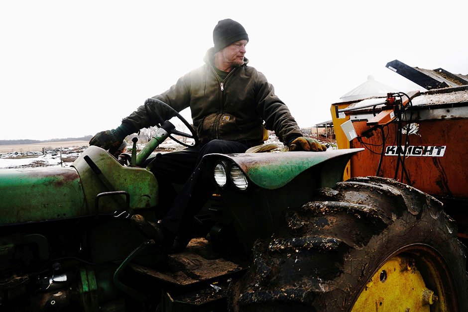 Belle Plain, Minnesota farmer driving a tractor