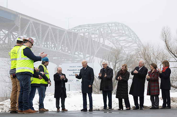President Joe Biden surveying the John A. Blatnik Bridge beside construction workers, state and local officials in Superior, Wisconsin, on Jan. 25, 2024.