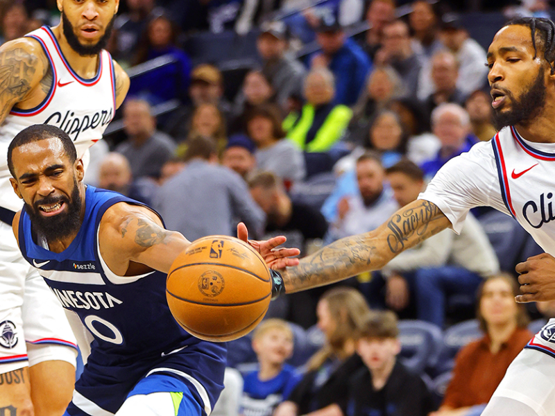 Los Angeles Clippers forward Derrick Jones Jr., right, knocks the ball away from Timberwolves guard Mike Conley, left, in the first quarter at Target Center on Monday.