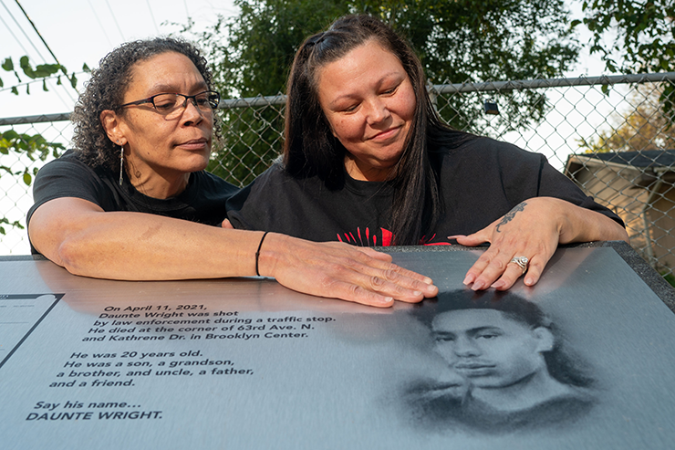 Amity Dimock and Katie Wright shown at the memorial for Daunte Wright in Brooklyn Park.