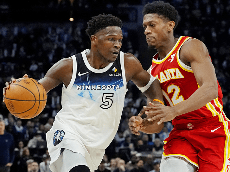 Timberwolves guard Anthony Edwards driving against Atlanta Hawks forward De'Andre Hunter in the third quarter at Target Center on Monday.