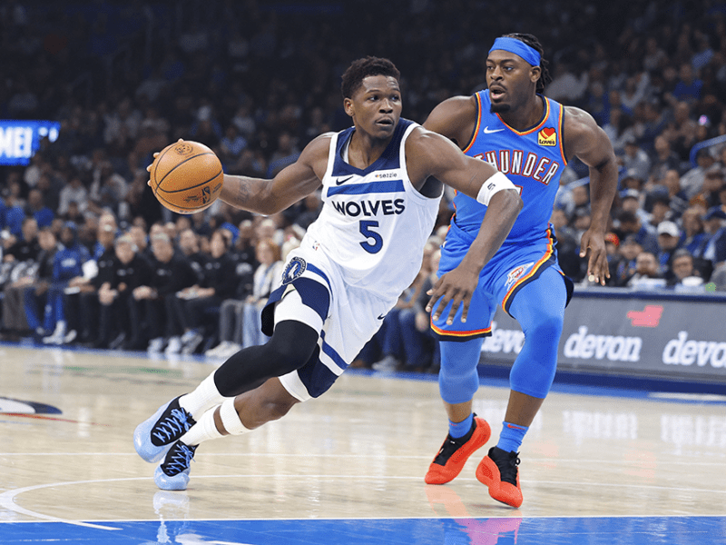 Timberwolves guard Anthony Edwards driving to the basket beside Oklahoma City Thunder guard Luguentz Dort during the first quarter at Paycom Center on Tuesday night.