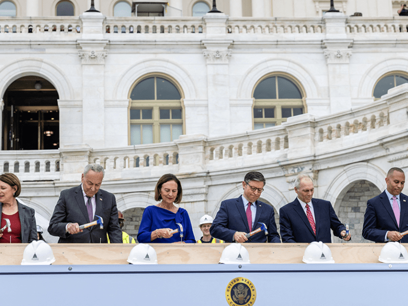 From left: Sen. Amy Klobuchar, Senate Majority Leader Chuck Schumer, Sen. Deb Fischer, Speaker of the House Mike Johnson, House Majority Leader Steve Scalise and House Minority Leader Hakeem Jeffries drive in the First Nails, signifying the start of construction on the 2025 Inaugural Platform.