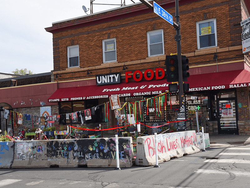 Cement walls and posters line the memorial of George Floyd Square in a photo from May 7, 2024.