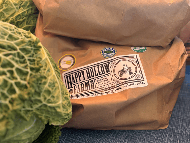 Produce from Happy Hollow Farm at the Columbia Farmers Market in Missouri on Saturday, Dec. 7, 2024 sports various labels, including “USDA Certified Organic.” Farmer Liz Graznak said the label is valuable and recognizable to customers.