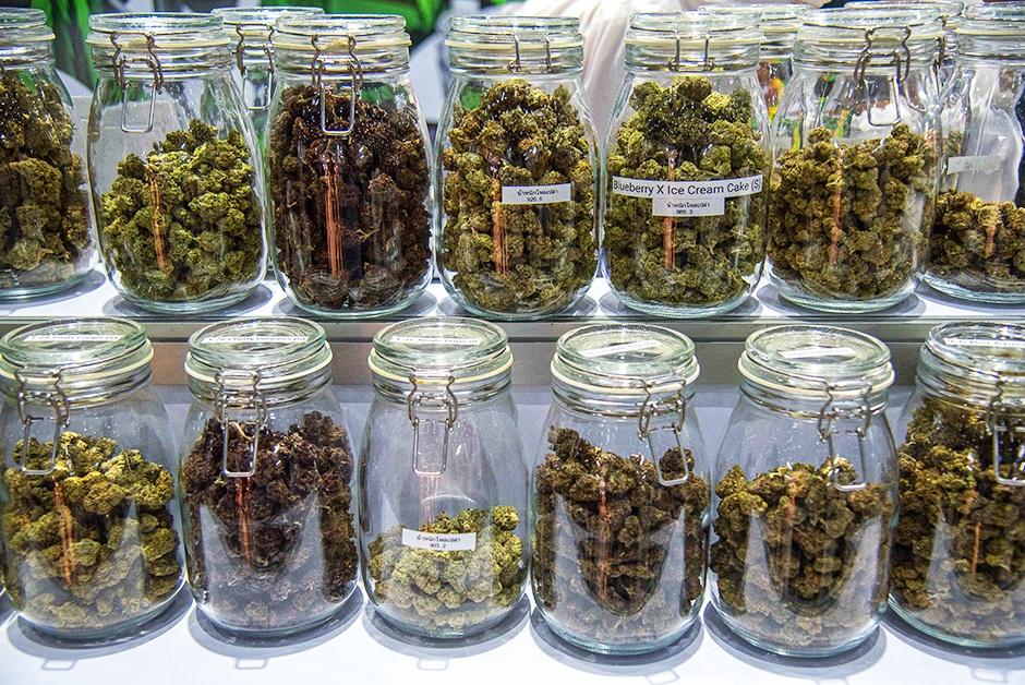 Hemp flowers in jars on display at the Asia International Hemp Expo 2023.
