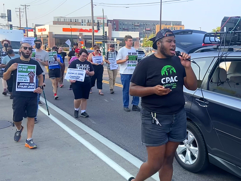 Jae Yates, right, leading a march on Thursday to launch a second effort to amend the city charter and establish the Civilian Police Accountability Commission.