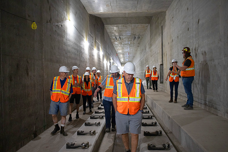 People walking inside the Kenilworth Tunnel during a tour of Southwest Light Rail construction led by Metro Transit in May.