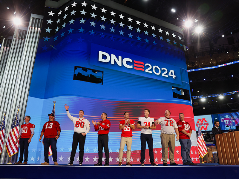 Former members of the Mankato West football team introducing Gov. Tim Walz on Day 3 of the Democratic National Convention at the United Center, in Chicago, Illinois.