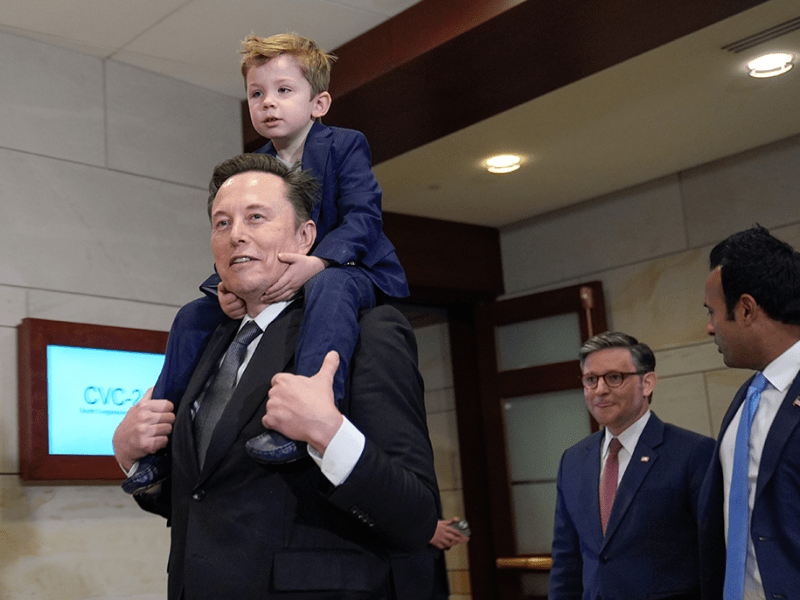 House Speaker Mike Johnson, center, hosts Elon Musk, left, carrying his son X Æ A-Xii and Vivek Ramaswamy, right, the co-leads of the newly established Department of Government Efficiency, at the Capitol on Dec. 5, 2024.