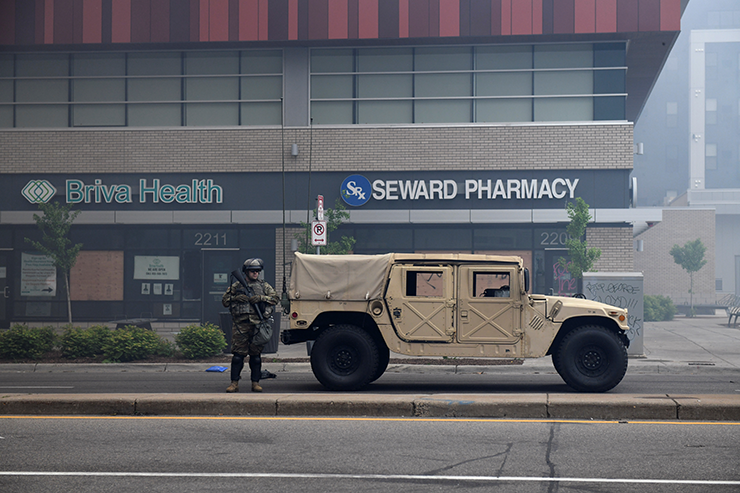 A National Guard service member blocking road access in front of Seward Pharmacy on East Lake Street on May 29.
