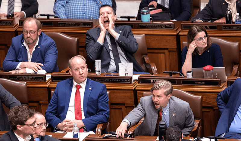 State Rep. Ben Davis, center back, and Rep. Harry Niska, lower right, yelling at the end of the 2024 legislative session.