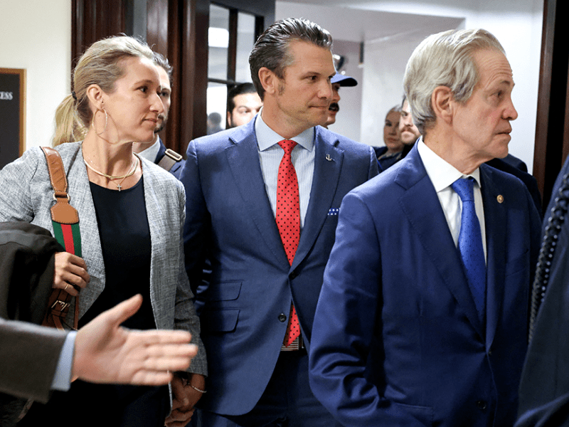 Defense secretary nominee Pete Hegseth, center, with former Sen. Norm Coleman at right, visiting senators on Capitol Hill on Thursday.