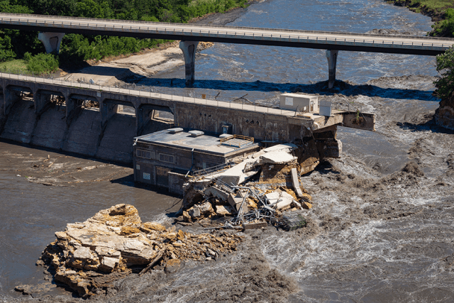 The bank of the Blue Earth River is seen after its collapse due to torrential rains, next to the Rapidan Dam southwest of Mankato, Minnesota, in a June 26 photograph.