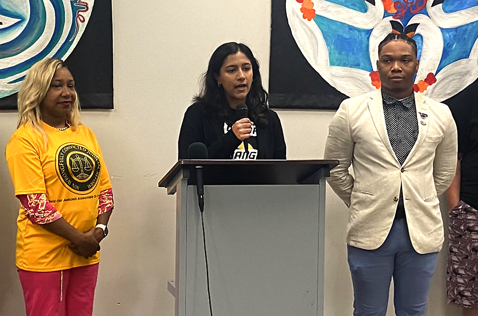 Color Of Change policy and government affairs manager Shruti Lakshmanan speaking at Thursday morning’s press conference as Minnesota Wrongfully Convicted Judicial Reform executive director Marvina Haynes and Black Community Board Minnesota founder Hassan As-Sidiq look on.