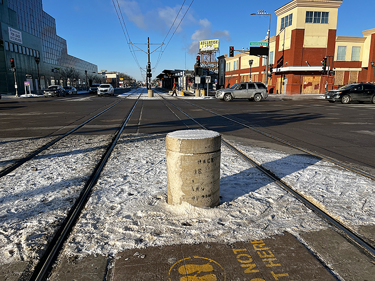 A large bollard protecting the light tracks at Snelling and University Avenues in St. Paul.