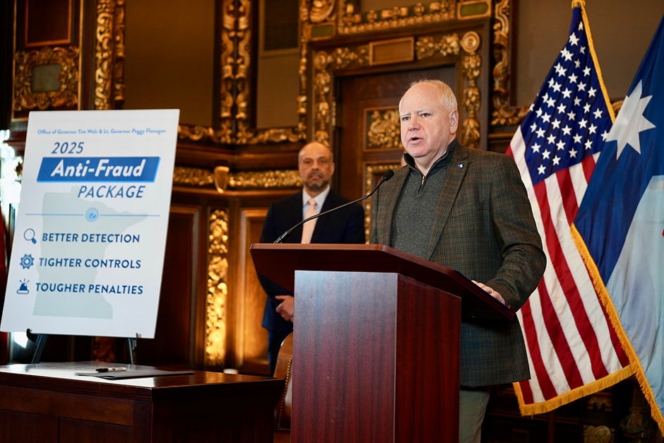Gov. Tim Walz speaking about anti-fraud initiatives on Jan. 3. Behind him is Tarek Tomes, commissioner of IT services.