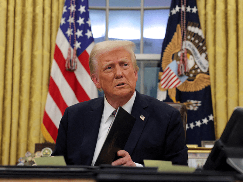 President Donald Trump signing executive orders in the Oval Office on Jan. 20.