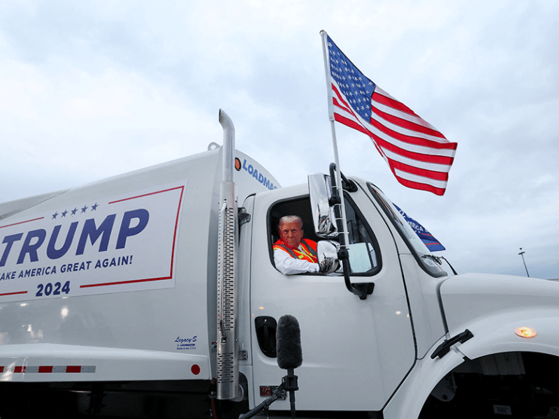 Former President Donald Trump sitting inside a garbage truck at Green Bay Austin Straubel International Airport in Green Bay, Wisconsin, on Wednesday.